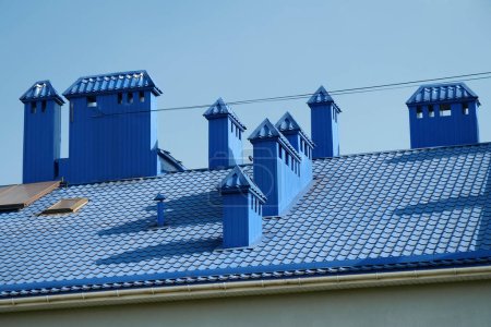 Photo for Blue roof of house with tiles and ventilation tubing - Royalty Free Image