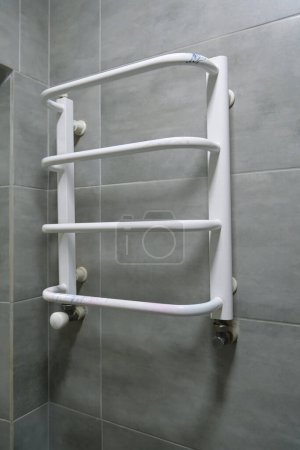 Photo for Heated towel rail in bathroom - Royalty Free Image