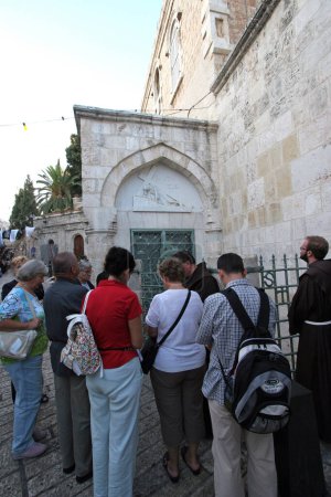 Photo for Pilgrims at the 3rd Station of the Cross in Via Dolorosa in Jerusalem, Israel - Royalty Free Image
