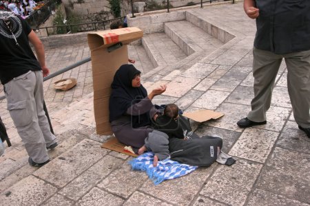 Photo for Muslim beggar woman in the old city of Jerusalem, Israel - Royalty Free Image