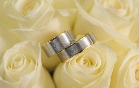 Photo for Close up view of wedding rings in bridal bouquet - Royalty Free Image