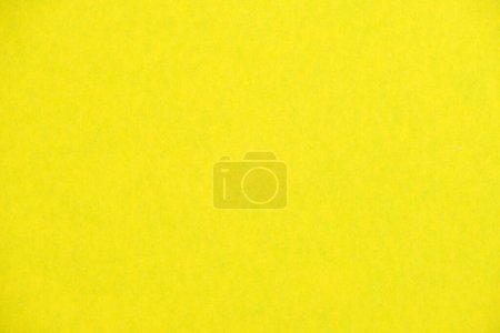 Yellow textured paper background close-up macro photography