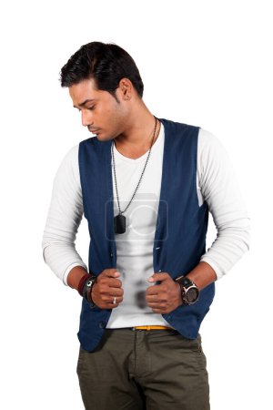 Photo for A handsome young Indian guy in a sleeveless stylish blue jacket. - Royalty Free Image