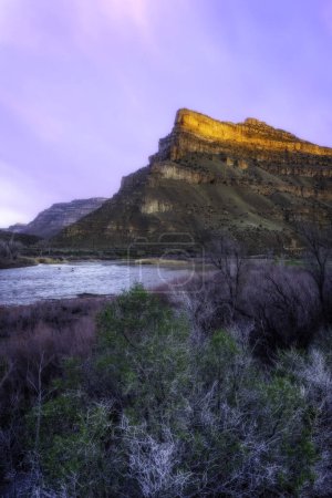 Photo for Sunrise at James M. Robb State park in Palisade Colorado. The Colorado River flows beneath the buttes in Debeque Canyon - Royalty Free Image
