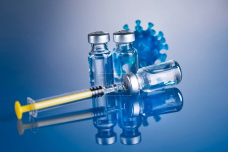 Photo for Close up medical syringe with a vaccine - Royalty Free Image