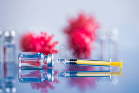 Photo for Close up medical syringe with a vaccine - Royalty Free Image