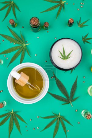 Photo for Cannabis leaf, oil and marijuana on a white background, cannabis leaf and a spoon with marijuana leaf, top view, flat lay. - Royalty Free Image