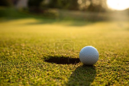 Photo for Golf balls on a golf ball on a green lawn - Royalty Free Image