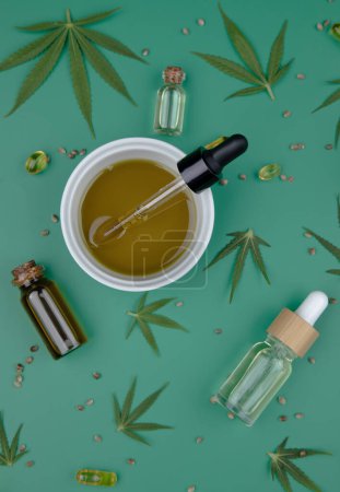 Photo for Composition with hemp oil and bottle of oil on color background - Royalty Free Image