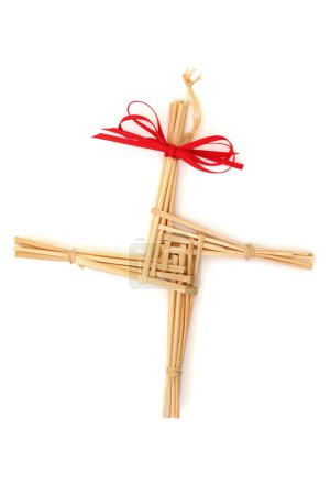 Photo for Saint Brigids Cross Irish pagan symbol of house blessing protection from evil and fire. Traditionally made in Ireland on Imbloc first day of Spring St Brigids feast day. On white top view. - Royalty Free Image