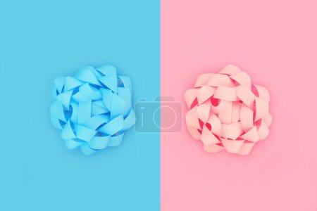 Photo for Pink for a girl blue for a boy design concept background with two pastel colored rosette bows. Minimal contrast composition of twins, duality and opposites attract. - Royalty Free Image