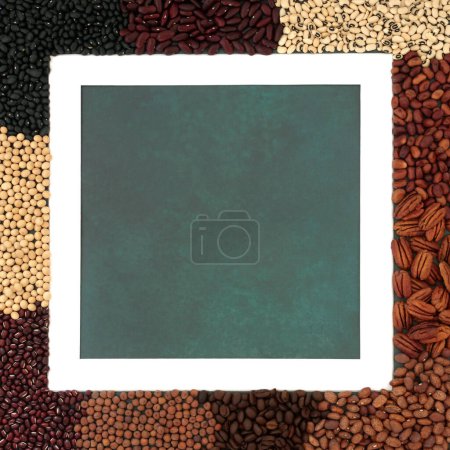 Photo for Legume health food collection. Dried vegetable pulses high in flavonoids, antioxidants, anthocyanins, polyphenols, vitamins, proteins, minerals, fibre. White frame border on viridian green. - Royalty Free Image