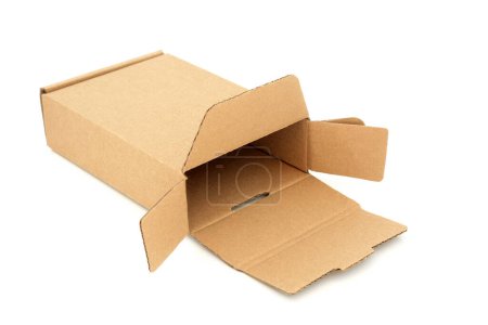 Photo for Slimline brown cardboard rectangular shape delivery packaging box on white background. Eco friendly recycled reusable material for delivery parcel. - Royalty Free Image