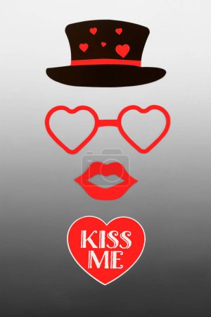 Photo for Kiss me romantic Valentines Day abstract with red heart and text with luscious lips, glasses and black hat. Surreal valentine romance design concept on gradient gray white. - Royalty Free Image