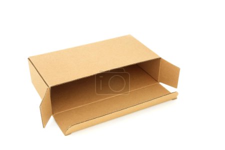 Photo for Slimline brown cardboard rectangular shape delivery box on white background. Environmentally friendly recycled reusable material for delivery parcel box. - Royalty Free Image