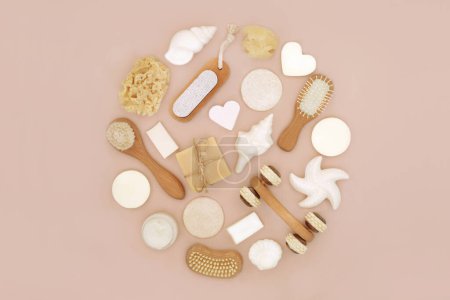 Natural skincare beauty treatment spa products abstract circular design on neutral beige background with assorted body care accessories for radiant skin.