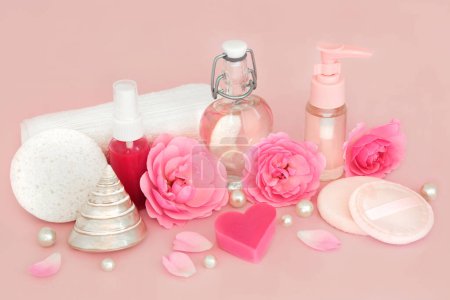 Pink rose flower beauty products, natural pure feminine health spa treatment for sensitive skin. Natural ingredients with soaps, moisturizer, gel, pearls and flowers.