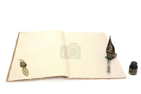 Ancient stationery writing equipment with retro feather quill pen, hemp notebook, opener, ink bottle on white background. Letter, document, journal, manuscript concept.