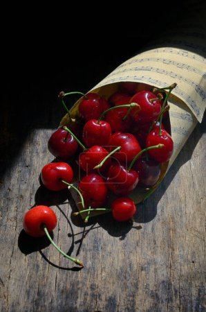 Photo for Closeup Cherry Fruits on Wooden Table - Royalty Free Image