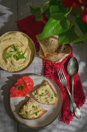 Photo for Healthy Appetizers Roasted Eggplant Salad and Sliced Bread - Royalty Free Image