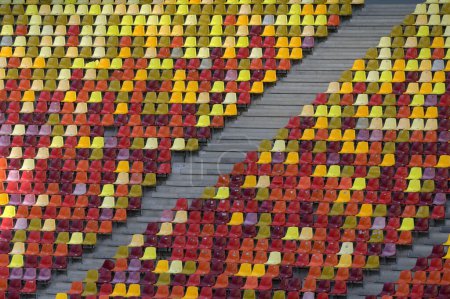 Photo for Colorful Rows Of Seats At Empty Open Air Stadium - Royalty Free Image