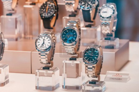 Photo for 26 July 2022, Munster, Germany: Very expensive vintage Omega luxury wristwaches and clocks for sale at store window. Classic famous watches - Royalty Free Image