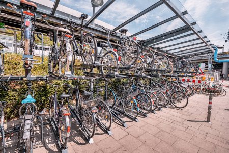 Photo for Two-storey intercept parking for bicycles near the city transport hub. Safe Storage and bicycle infrastructure in a modern city - Royalty Free Image