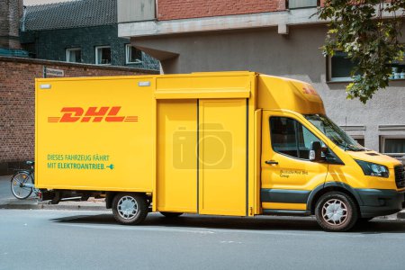 Photo for 29 July 2022, Cologne, Germany: DHL logistic and delivery service car or van at city street - Royalty Free Image