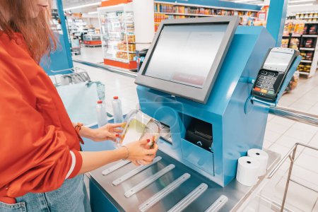 automated self-service checkout at the supermarket allows customers to quickly scan and pay for their items without the need for a cashier.