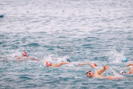 Photo for 28 May 2023, Antalya, Turkey: Athletes and amateur men starting in open water sea swimming competitions - Royalty Free Image