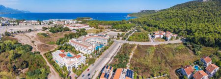 Photo for Picturesque village resort Kemer in Turkey, boasting an enticing swimming pool, a stunning panoramic view from above - Royalty Free Image