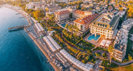 Photo for Picturesque village resort Kemer in Turkey, boasting a hotels with enticing swimming pool, a stunning panoramic view from above. - Royalty Free Image