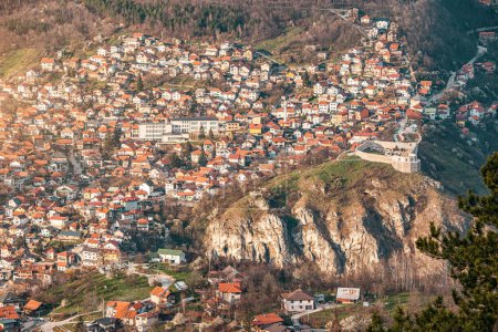 Sarajevo's cityscape unfolds in a picturesque view, with the white fortress contrasting against the vibrant colors of the Balkan landscape.