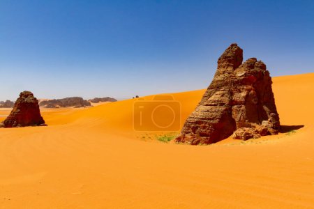 Photo for Big sand dunes and amazing rock towers of Tin Merzouga.   Tadrart mountains, Tassili n'Ajjer National Park, Algeria, Illizi,  Sahara, Afrika - Royalty Free Image