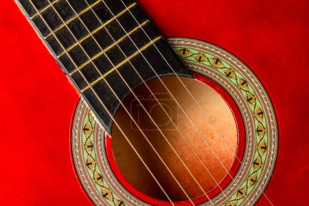 Photo for Close-up. A part of a red acoustic guitar. Background. - Royalty Free Image