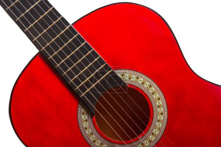 Photo for Close-up. A part of a red acoustic guitar  A part of a red acoustic guitar on white background - Royalty Free Image