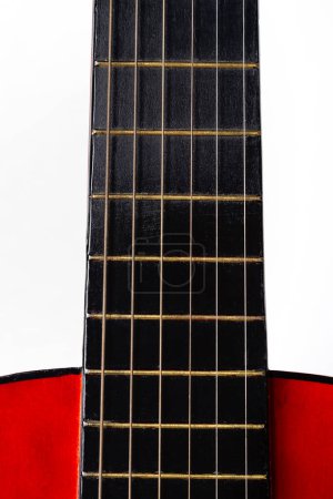 Photo for Close-up. A part of a red acoustic guitar on white background - Royalty Free Image