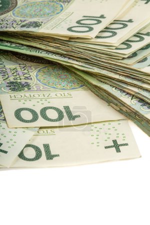 Téléchargez les photos : Une grande pile de billets de 100 zlotys polonais sur fond blanc. Synonyme de richesse et d'abondance. - en image libre de droit