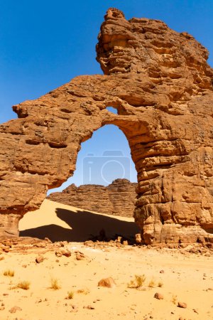 Photo for Tikoubaouine Arch - amazing rock formation at Tikoubaouine.   Tassili n'Ajjer National Park, Algeria - Royalty Free Image