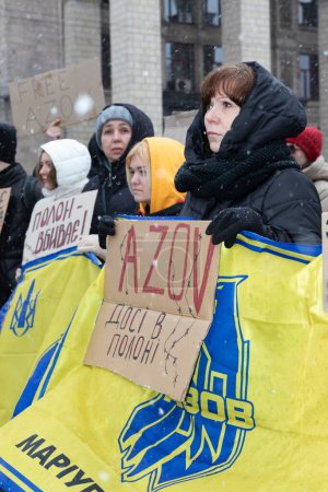 Photo for KYIV, UKRAINE - Feb. 18, 2024: A group of protesters is seen holding placards in support of Ukrainian prisoners of war on the central square of the Ukrainian capital. - Royalty Free Image