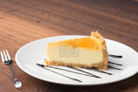 Photo for Slice of cheese cake with dark background - Royalty Free Image