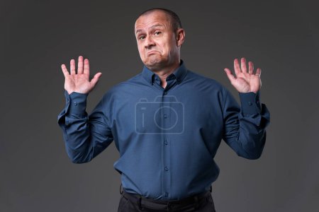 Photo for Impartial businessman raising his hands to signal his neutrality - Royalty Free Image