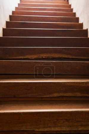 Photo for Indoor wooden staircase with oak wood stairs in a vintage home - Royalty Free Image