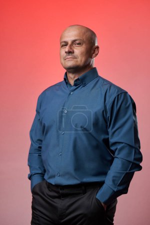 Photo for Portrait of a successful businessman standing with hands in his pockets, roman color - Royalty Free Image