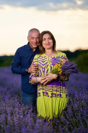 Photo for Portrait of a romantic couple in a lavender field at sunset - Royalty Free Image