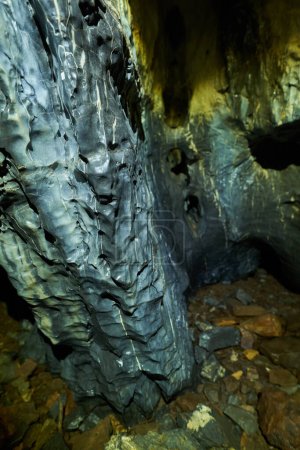 Photo for Dark cave formed in millions of years in the limestone mountains - Royalty Free Image