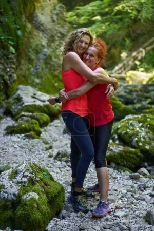 Photo for Two women friends enjoying a holiday with canyon exploration and hiking, having fun - Royalty Free Image