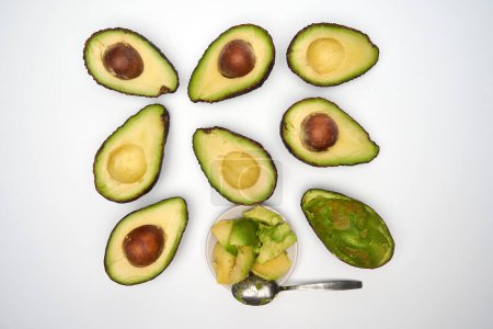 Photo for Closeup of fresh avocado sliced isolated on white background - Royalty Free Image