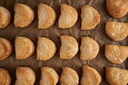 Photo for Puff pastry with cheese in closeup, fresh from the oven - Royalty Free Image