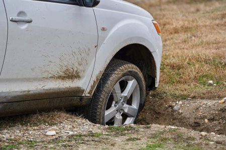 Photo for Off road SUV car crashed into a ditch on a track course - Royalty Free Image